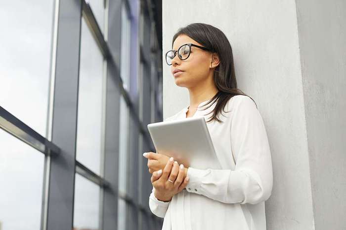 businesswoman-with-tablet-pc-at-office
