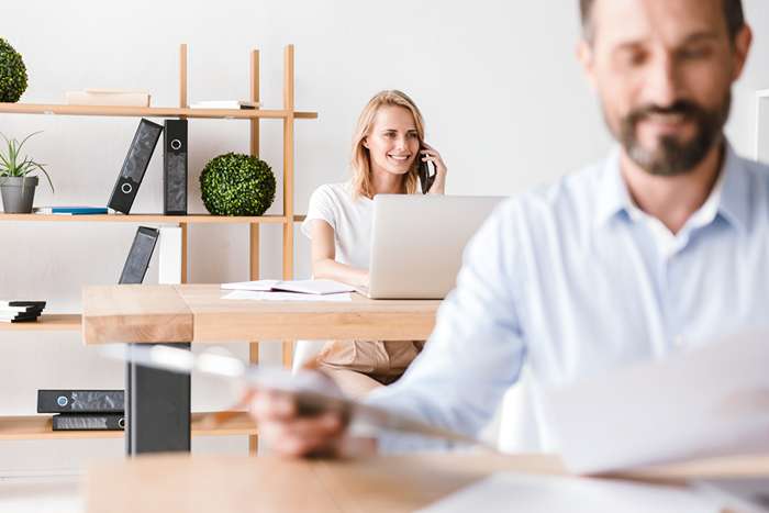 confident-man-manager-working-on-laptop-computer-