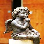 cupid-sitting-on-stone-2026-03-19-07-07-04-utc